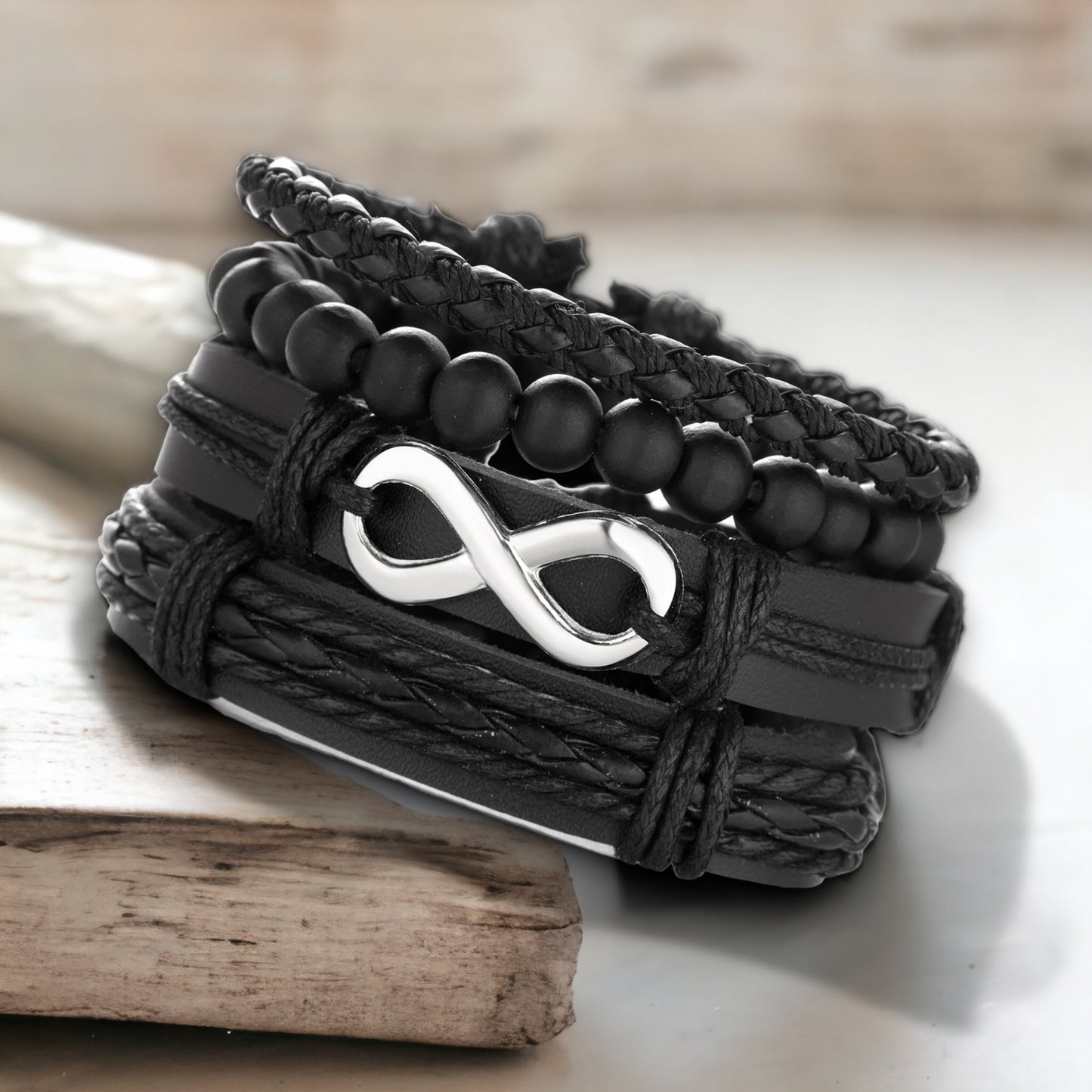 Vierdelige armbandenset met stalen infinity teken