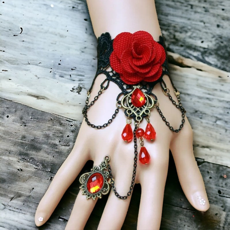 Zwart kanten polsstuk met rode roos en rode pareltjes