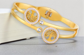 Stijve damesarmband met twee levensboomjes en strassteentjes