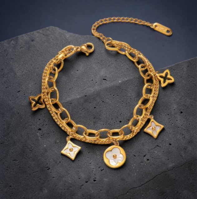 Dubbele armband met klavertjes en sterretjes
