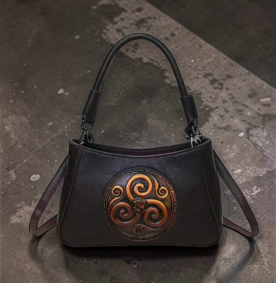 Compacte handtas met Triskelion