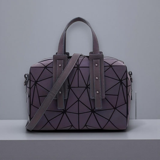 Reflecterende handtas met geometrische vormen