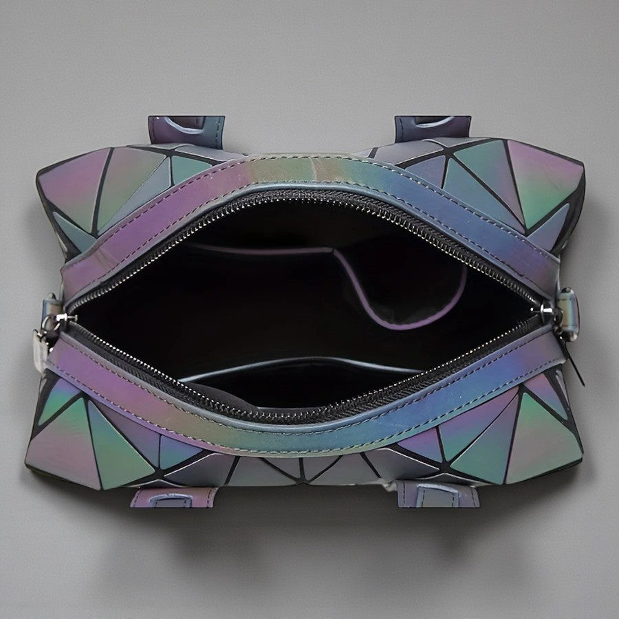Reflecterende handtas met geometrische vormen
