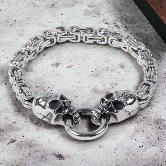 Stalen armband met fantasieschakel en 2 skulls met ring in mond