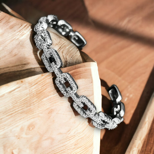 Stijve open armband met schakels en strassteentjes